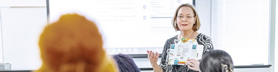 A professor speaking to a classroom full of nutrition students