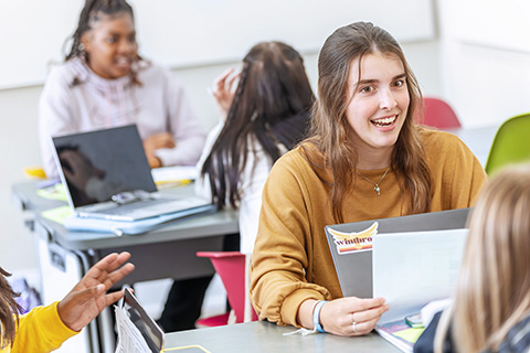 a group of students working together in class