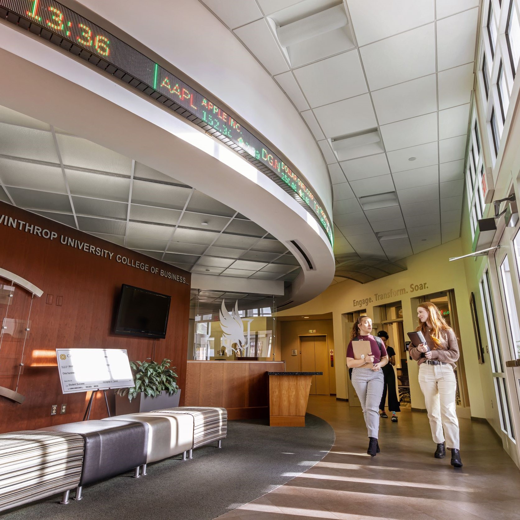 Students are walking the hall of Carroll Hall