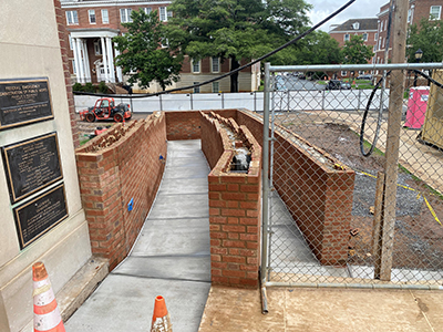 Poured concrete handicap ramp with bricks