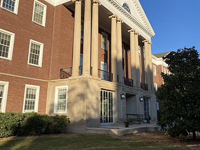 New black railings on brick building, Sims