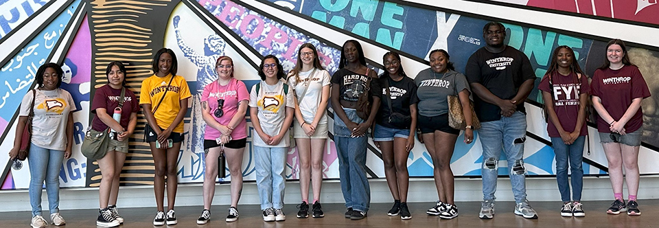 a group photo of McNair Scholars students gathered outside on campus