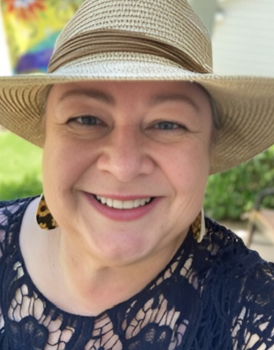 Close up of a woman wearing a sunhat and blouse