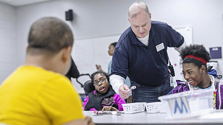 A teacher working with young children who have disabilities