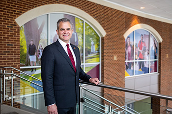 Winthrop President Edward Serna standing in the DiGiorgio Student Center